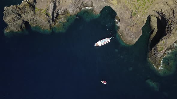 Aerial View on Anchored Pleasure Boat, People Swimming in Mediterranean Sea, Rocks and Mountain of