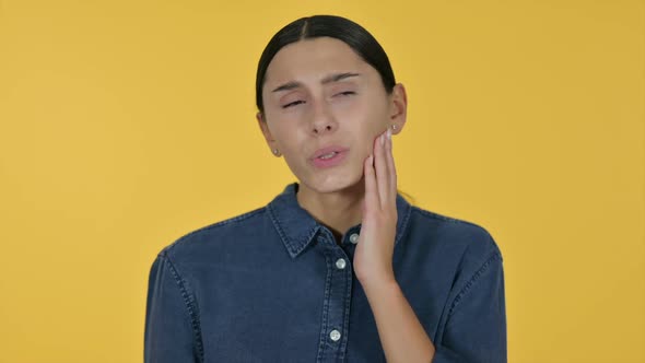 Latin Woman with Cavity Toothache Yellow Background