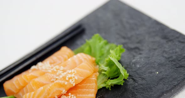 Sushi served on tray with chopsticks