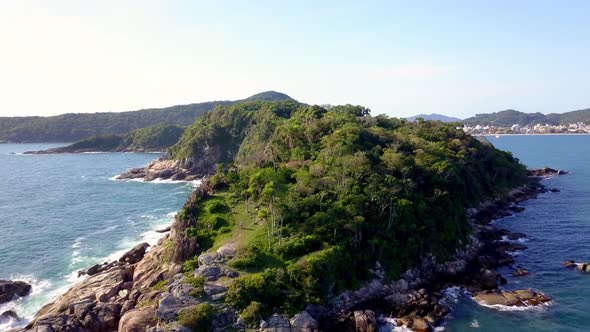 Aerial shot flying over the Trilha da Sepultura, a hiking area in Bombinhas, Brazil