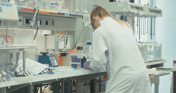 Scientist working in a pharmaceutical laboratory conducting experiments