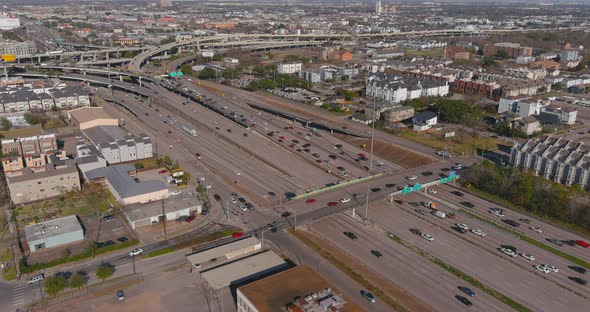 Establishing aerial shot of traffic on 59 South freeway near downtown Houston.