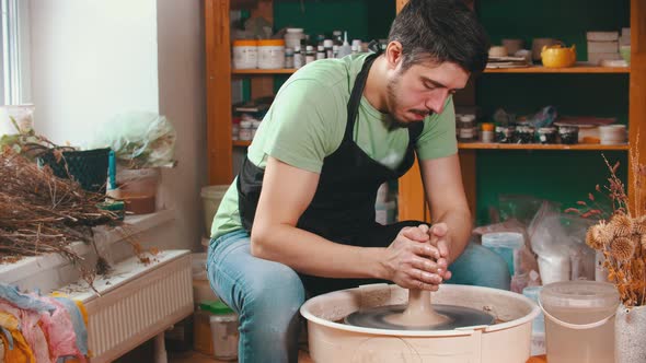Pottery - the Master Is Wetting the Clay for Better Glide