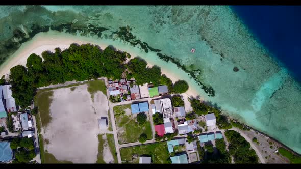 Aerial above sky of luxury seashore beach time by turquoise ocean with white sand background of adve