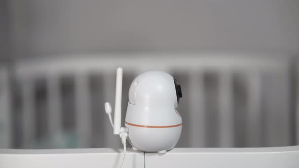 The Baby Monitor Camera with the Rotation Function Monitors the Child in the Room