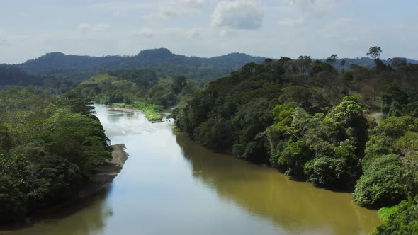 Aerial Drone View of Rainforest River and Mountains Scenery in Costa Rica at Boca Tapada, San Carlos