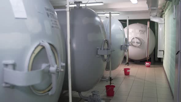 Huge Storage Tanks for Alcoholic Beverages at Factory. In Tanks Support Certain Conditions for