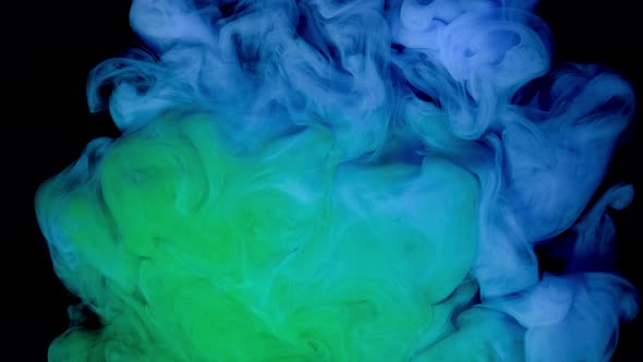 Blue and Green Paint Drops in Water with Black Background Abstract Color Mix Drop of Ink Paint