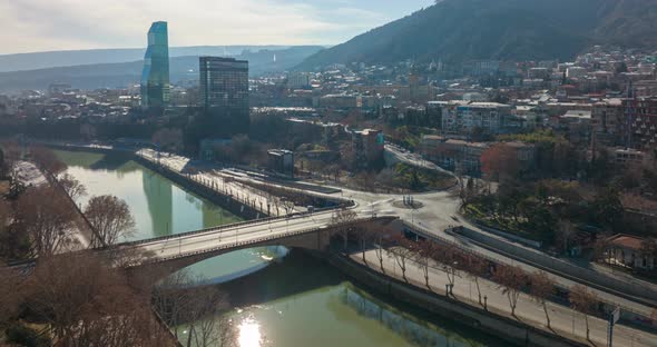 aerial time lapse shot of Galaktion Tabidze bridge in center of Tbilisi, Georgia 2022