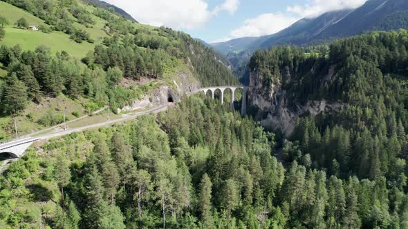 Landwasser Viaduct in Swiss Alps in Summer Aerial View on Green Mountain Valley