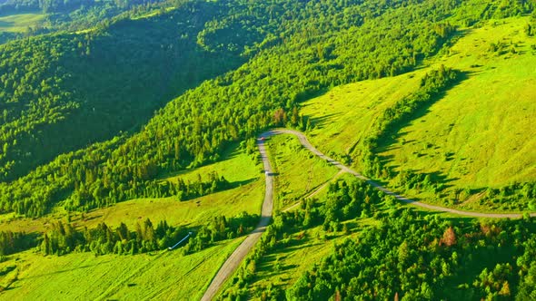 Drone Flying Above Route in Mountains