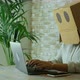 Identity and security online concept with people working on laptop with carton box on his head. - VideoHive Item for Sale