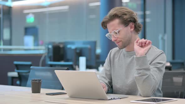 Young Businessman with Laptop Having Wrist Pain