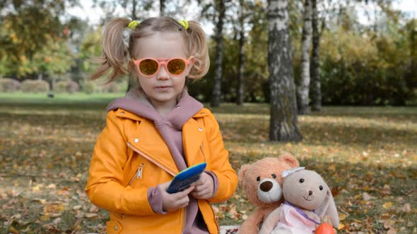 Cute Little Caucasian Girl Looking At Camera