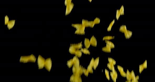 Farfalle Italian Pasta flying in front of black background