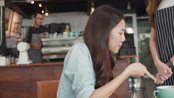 Asia freelance lady client talk dispute with millennial waitress feel dissatisfied with cafe.