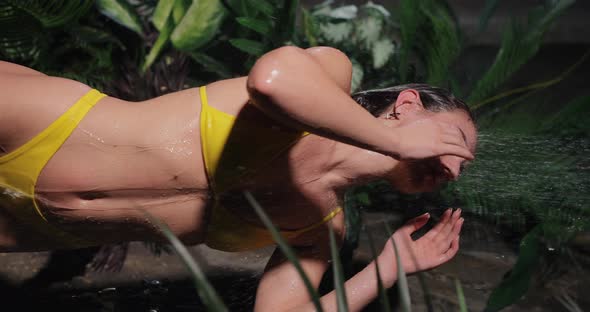 Attractive Woman Takes a Tropical Shower Slow Motion Vertical Video