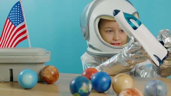 Smiling Child Launches a Space Rocket Closeup a Pilot Traveling in Space