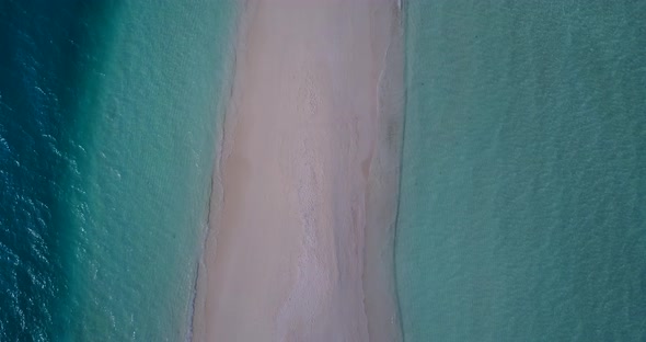 Tropical overhead clean view of a white paradise beach and turquoise sea background in colorful 4K