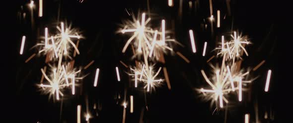 Abstract sparklers burning in the black background. Holiday, celebration concept.