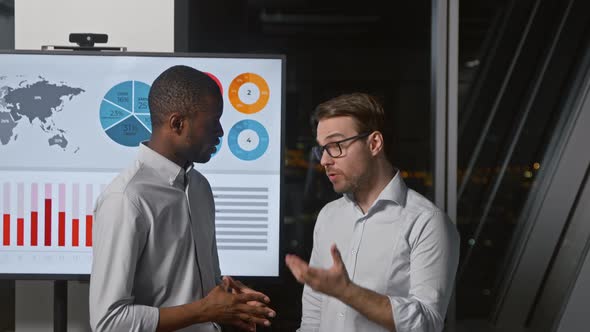 Young business partners talking at office meeting room