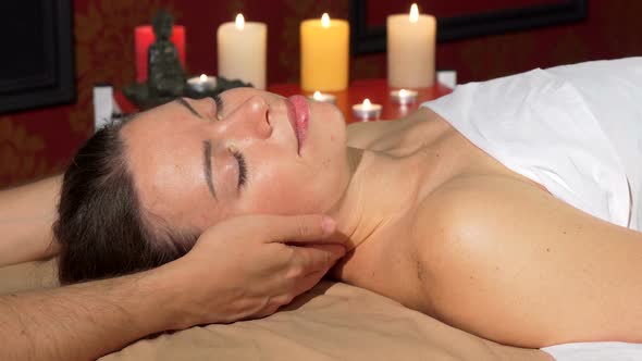 Happy Attractive Woman Smiling To the Camera After Relaxing Neck Massage