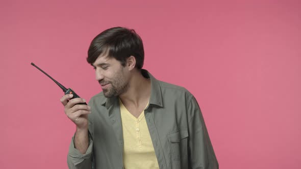 Portrait of Happy Carefree Handsome Young Man Fool Around on Work Talking with Friend Coworker Using