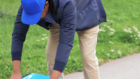 Happy Food Delivery Man Giving Order to Customer