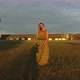 Beautiful women walking barefoot in grass at sunset - VideoHive Item for Sale
