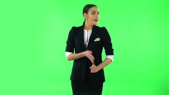 Young Woman Stands Waiting with Boredom on Green Screen