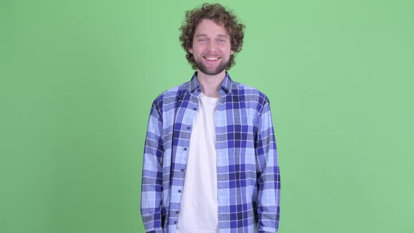 Happy Young Bearded Hipster Man Smiling