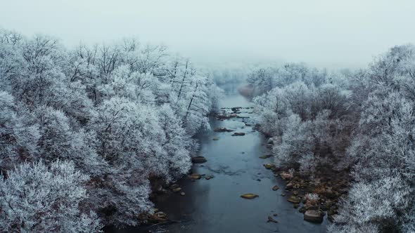 Winter forest river. Aerial view of winter forest wild river landscape