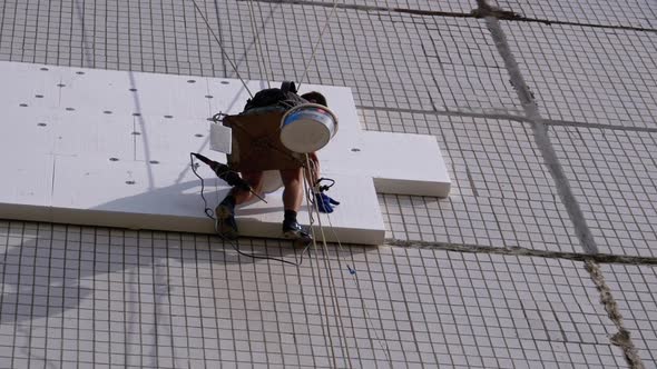 Industrial Climber Insulation of Facade Old High-Rise Building Using Styrofoam