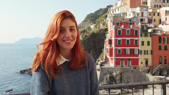 Tourist Girl Smiles and Has Fun in Riomaggiore City of the Cinque Terre