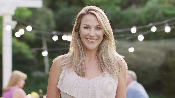 Young woman smiling outdoors