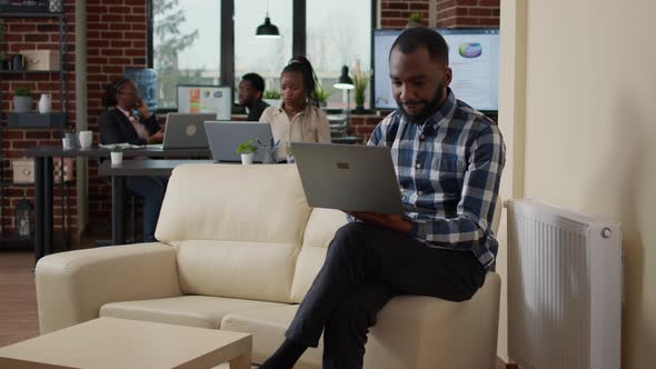 Young Man Working with Laptop to Create Financial Investment