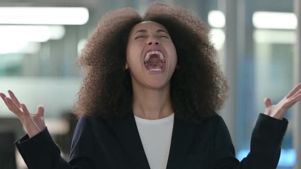 Portrait of Attractive African Businesswoman Screaming Shouting