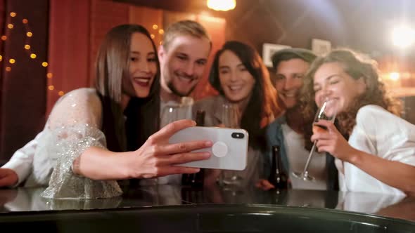 Young Cheerful Female Friends Taking Selfie In Pub Using Phone. Friends, Men, Women, Leisure