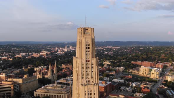 A "zolly" aerial establishing shot of the top of the Cathedral of Learning in Pittsburgh's Oakland d