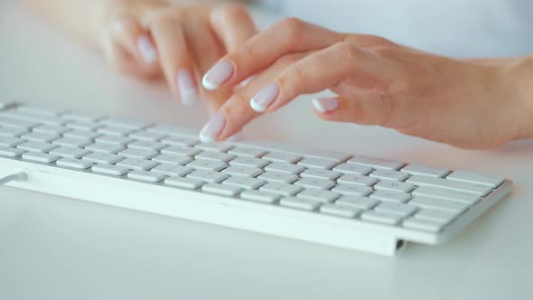 Female Hands Typing on a Computer Keyboard