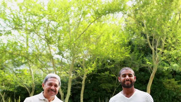 Portrait of happy family standing in park 4k