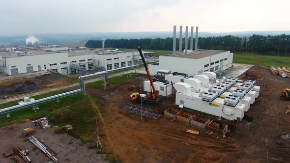 Large industrial zone with plants aerial view. Many factories from the air. 