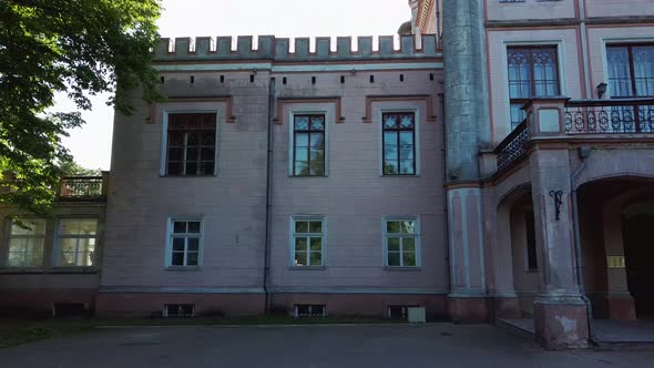 Vecauce Manor in Latvia Aerial View of the Pink Castle Through the Park. Vecauce Castle Tower With a