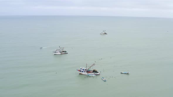 Aerial view, circling around a smal fishing boat 