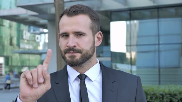 No Beard Businessman Rejecting Offer By Waving Finger