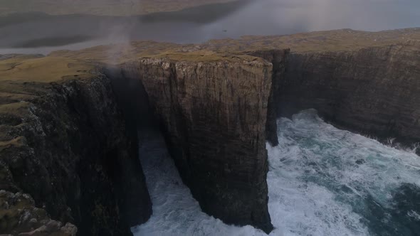 Drone Footage of Waves Crashing into Shoreline Cliffs