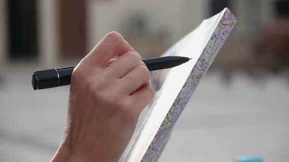 Closeup of Woman's Hands Holding City Map, Sightseeing Tour, Checking Direction