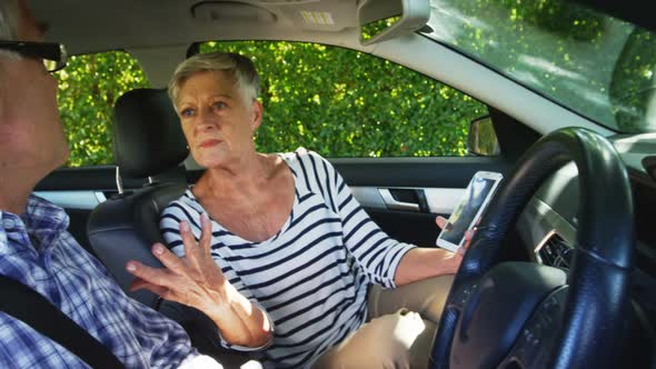 Senior couple arguing in the car