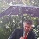 Businessman Sheltering Underneath a Broken Umbrella in the Rain - VideoHive Item for Sale