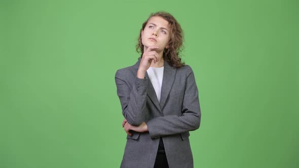 Young Beautiful Businesswoman Thinking with Hand on Chin